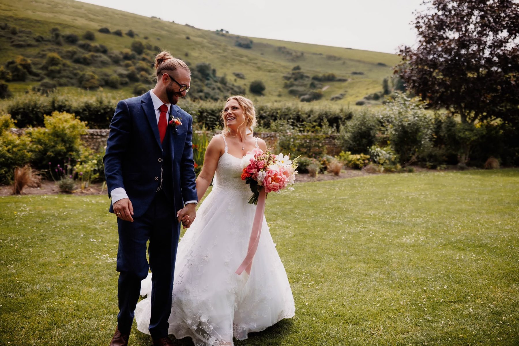 Newlyweds enjoying their wedding day in the Sussex countryside